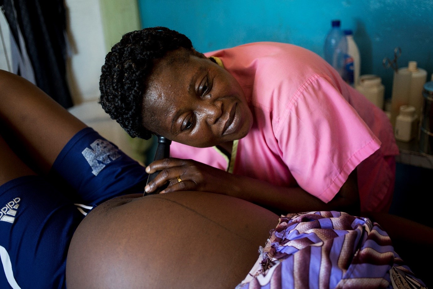 Antenatal care nurse Chantal examines Christella, an expectant mother, in Kenge, DRC. Christella was referred to the health center by a TIPTOP community health worker to ensure a healthy pregnancy (Credit: Karel Prinsloo / Jhpiego).