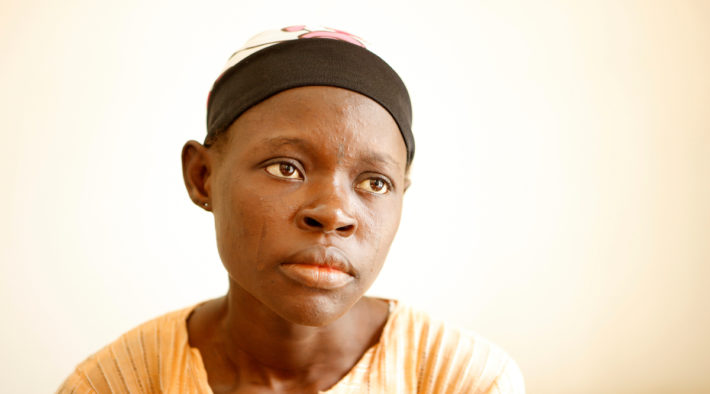 Ajara waits at the ART clinic. She is coinfected with HIV and TB. Image: John Rae / The Global Fund